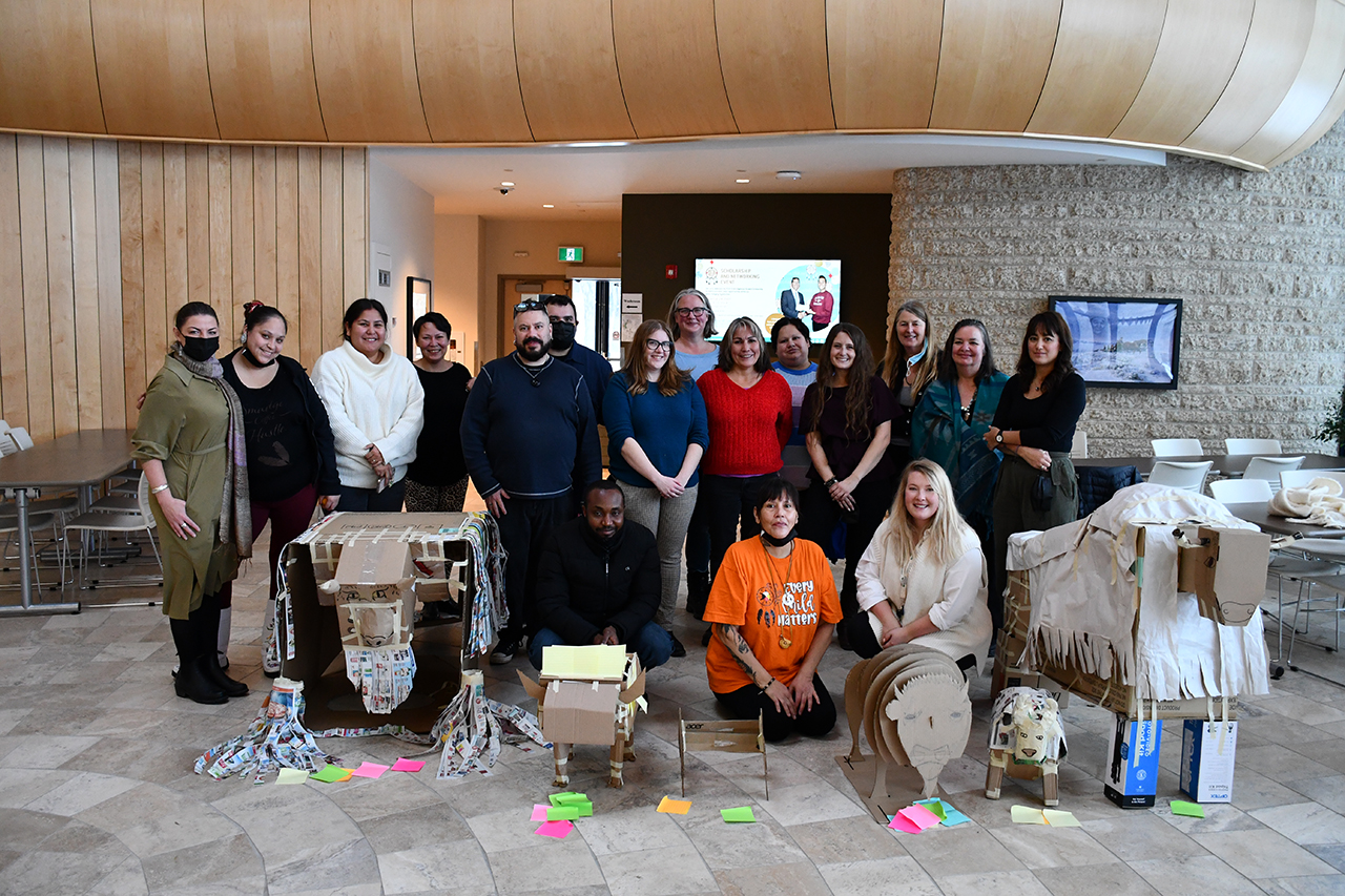 Photo of Pewaseskwan staff following a team building exercise of building buffalo/bison.